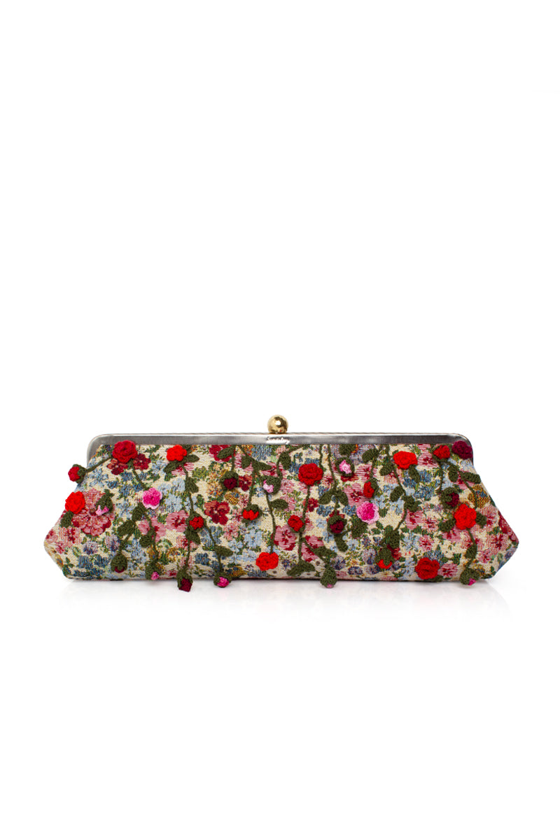 Multicolor Roses Le Long clutch by Sarah's Bag featuring floral design and elegant shape, perfect for stylish accessories.