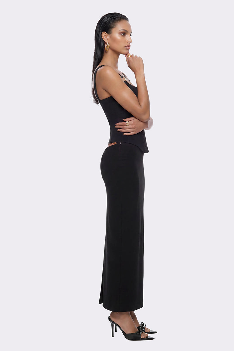 Black Nana Jacqueline Rosetta maxi skirt with ring detail, flowing fabric, and elegant design for stylish summer wear.