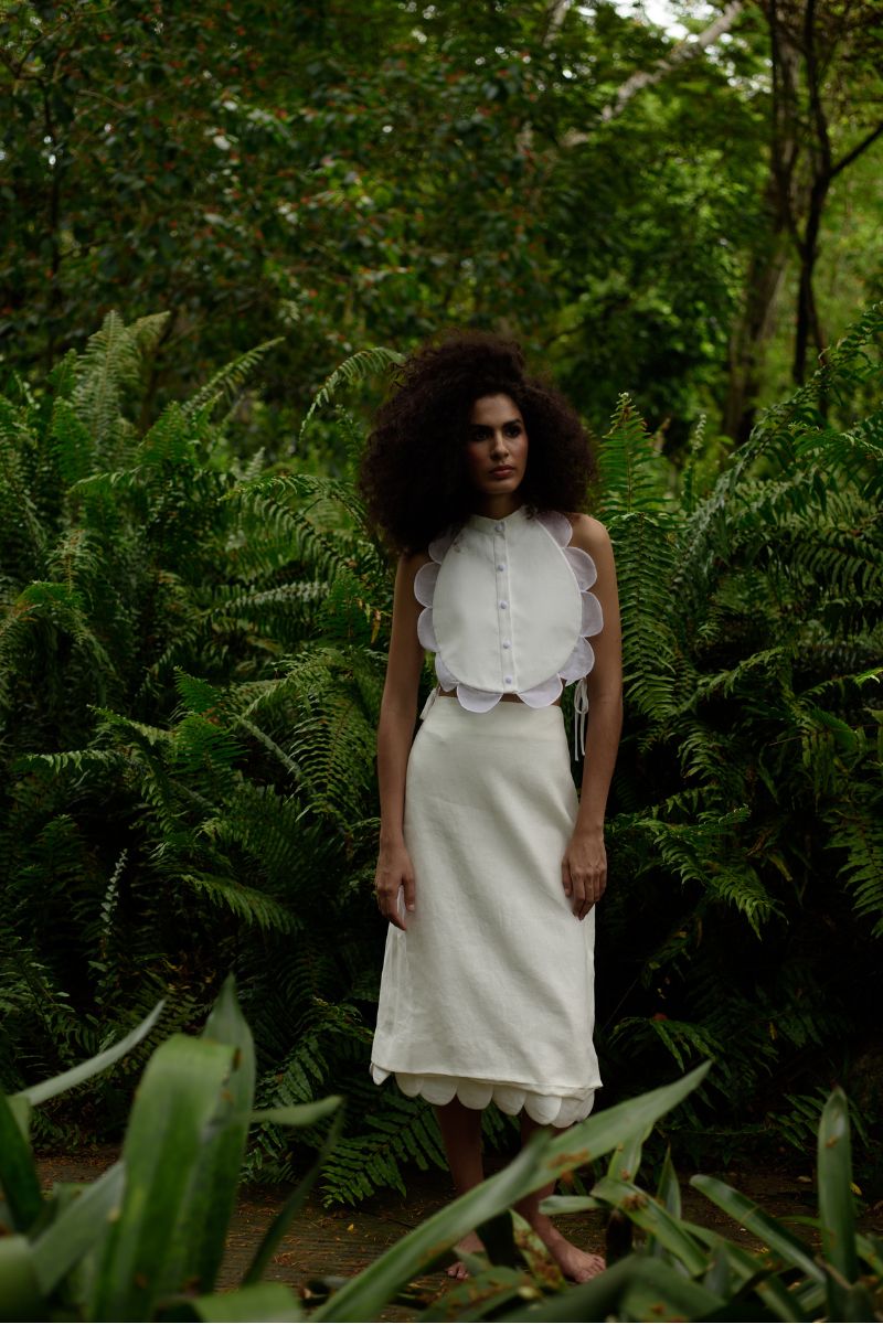 Ivory rossette midi skirt from ANA + MARIA featuring floral embellishments and a flowy, elegant design.