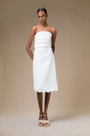 Elegant ivory rossette midi skirt by Ana + Maria displayed on a model with soft fabric detailing.