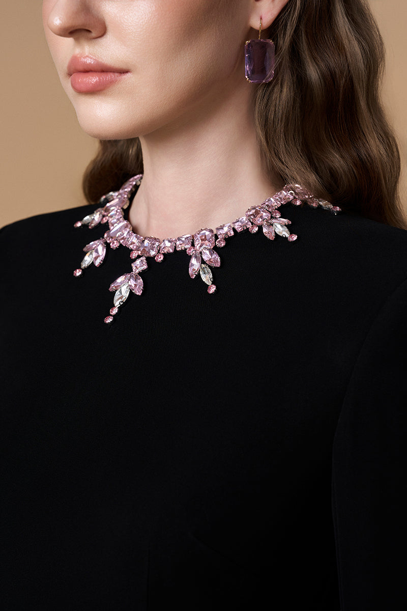 Black crepe silk lined embellished gown with a round neck and long sleeves by I.H.F. Elegant evening wear.