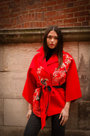 Nadya Shah Ruby Cassis belted jacket with a stylish fit, featuring a classic collar and waist belt, shown on a model.