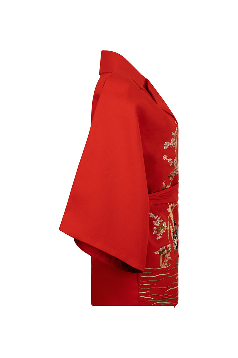 Nadya Shah Ruby Casissle belted jacket displayed on a mannequin, featuring a stylish design with a belt at the waist.