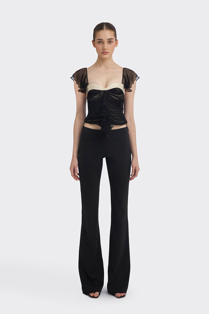 Black ruched mini top from Stolen Stores, featuring fitted design and stylish ruching details, perfect for casual or night-out wear.