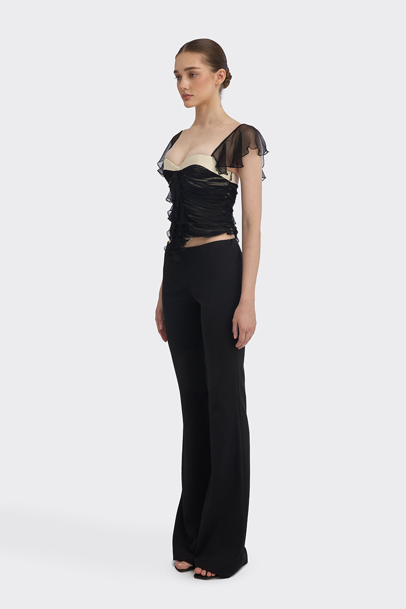 Black ruched mini top from Stolen Stores, featuring fitted design and stylish detailing, perfect for casual or night-out wear.