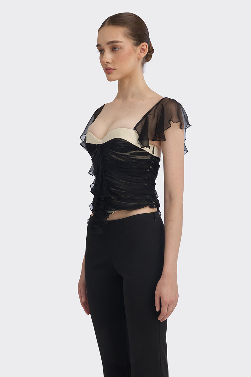 Black ruched mini top from Stolen Stores, featuring a fitted design and stylish detailing, perfect for casual or night-out wear.