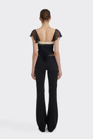 Black ruched mini top by Stolen Stores, featuring a fitted design with gathered fabric and stylish detailing.