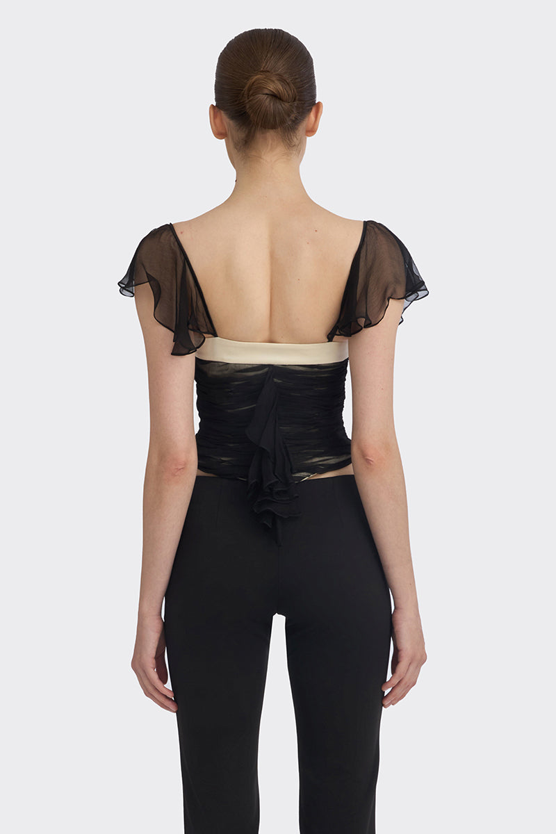 Black ruched mini top from Stolen Stores, featuring a fitted design and stylish ruched detailing.