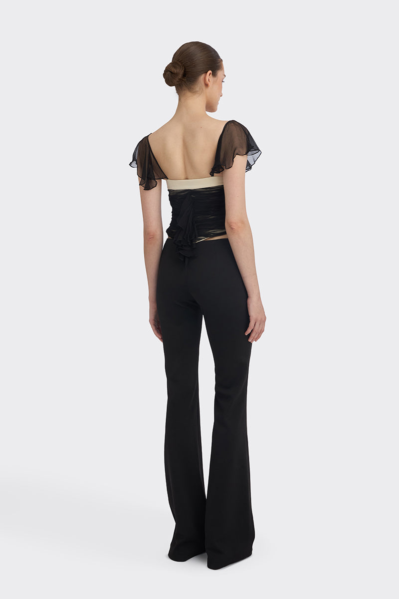 Black ruched mini top from Stolen Stores, featuring fitted design and stylish details, perfect for trendy casual wear.