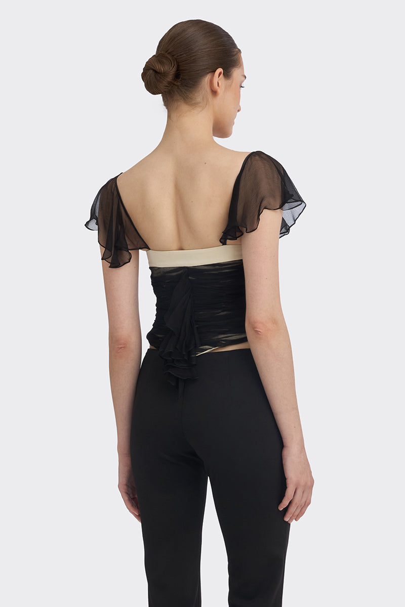 Black ruched mini top by Stolen Stores, featuring gathered fabric design, shown on a mannequin.