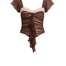 Brown ruched mini top by Stolen Stores, featuring gathered fabric and a fitted style, shown on a model.