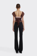 Brown ruched mini top by Stolen Stores, showing close-up of gathered fabric and sleeveless design, perfect for casual wear.