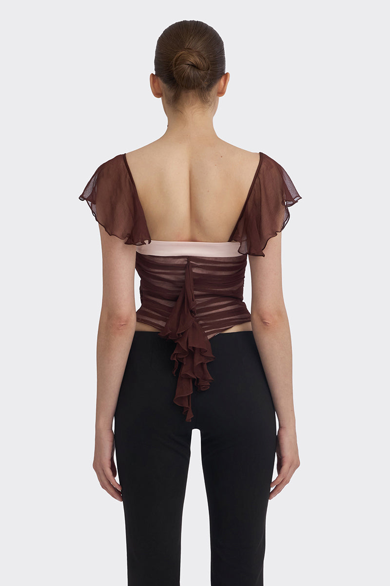 Brown ruched mini top by Stolen Stores, showcasing a fitted, textured design with ruched detailing on the fabric.