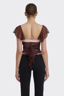 Brown ruched mini top by Stolen Stores, showcasing a fitted, textured design with ruched detailing on the fabric.
