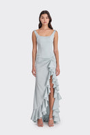 Dusty blue ruffle slit maxi dress by Stolen Stores, flowing fabric with elegant ruffle detail and side slit.