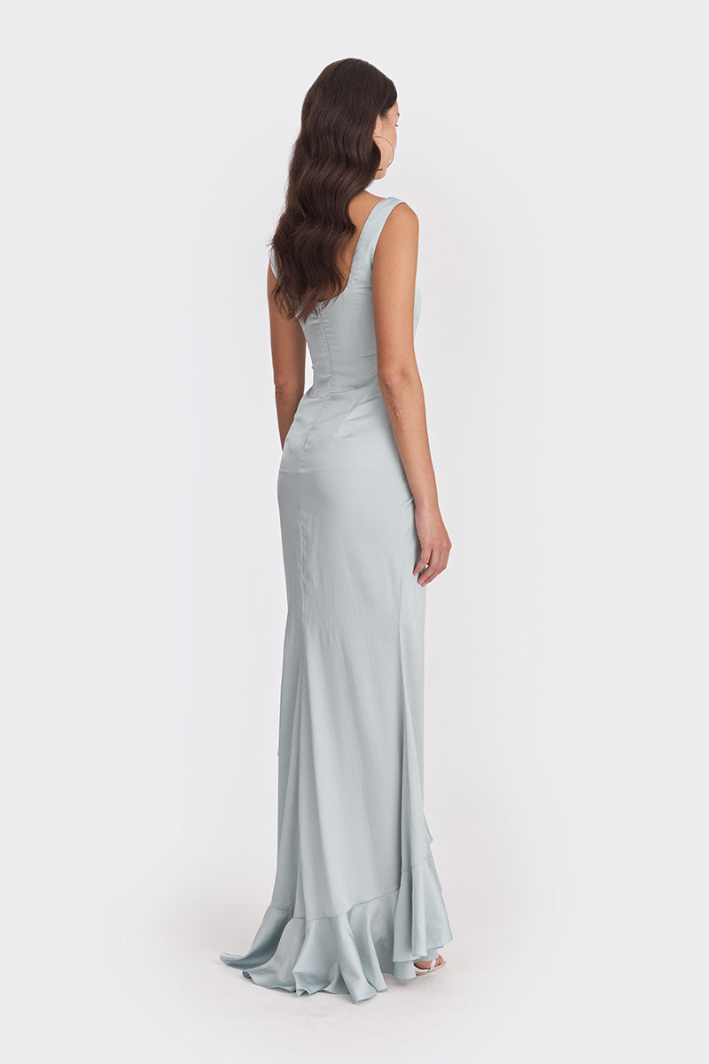 Dusty blue ruffle slit maxi dress by Stolen Stores featuring flowing fabric and elegant design for summer occasions.