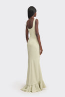 Light green CULT MIA X Stolen Stores ruffle split maxi dress displayed on a hanger against a neutral background.