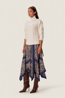 Rebecca Taylor Tatum scarf midi skirt shown from side in marmalade with flowing fabric and stylish design.