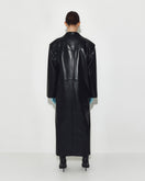 Black leather coat by Sayya, stylish and warm outerwear for men or women, shown on a hanger against a neutral background.