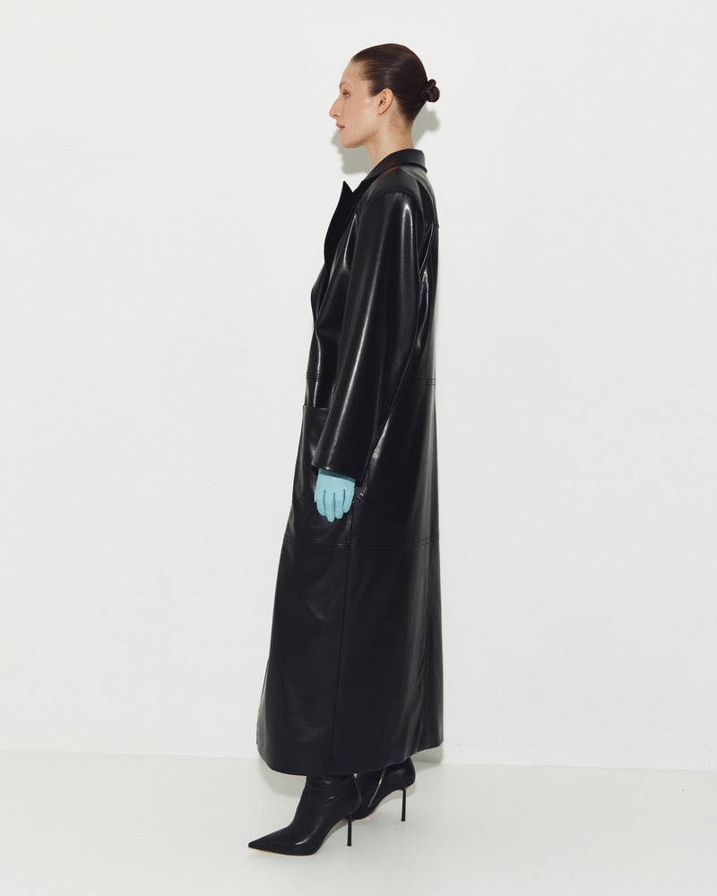 Black leather coat by Sayya, stylish and sleek, featuring a classic design with detailed stitching and a front button closure.