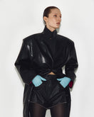 Black Sayya mini shorts displayed on a hanger, showcasing their slim fit and stylish design.