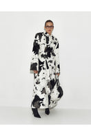 Sayya FUR MAXI COAT IN COW, a stylish long coat made from cow fur, showcasing a plush, luxurious texture and elegant design.