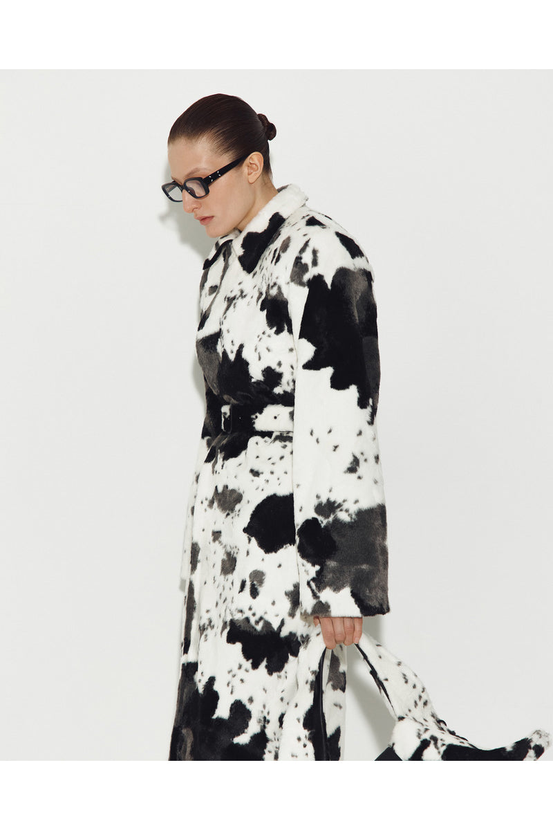 Sayya Fur Maxi Coat in cow print, stylish long coat with plush fur texture, perfect for cold weather fashion.