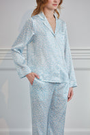 Blue Gentle Leo women's pajama set by MANITO, soft fabric with a relaxed fit, displayed on a hanger.