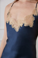 Blue lace-trimmed slip dress by MANITO, a stylish mini dress featuring delicate lace details and a comfortable fit.