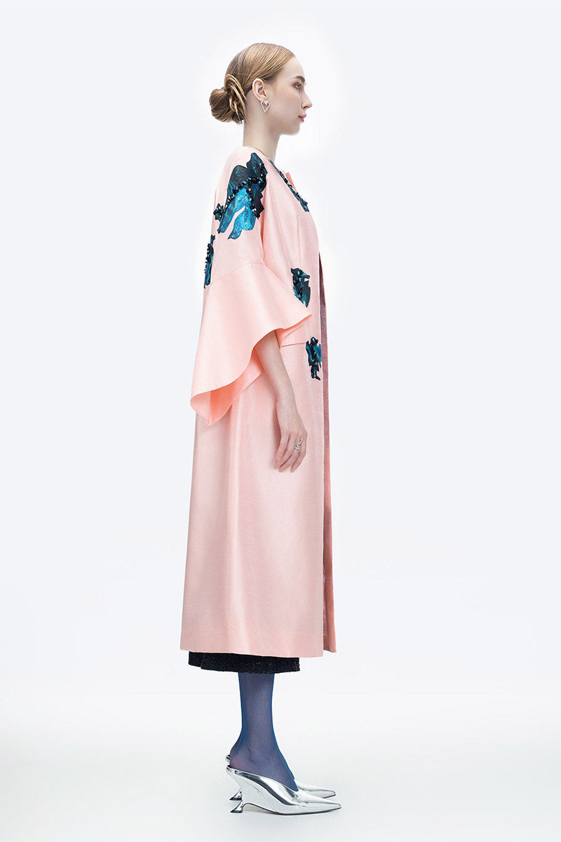 Pink Inner Blossom coat by Tiny Ink, stylish and cozy outerwear with a floral-inspired design, shown in the product image.