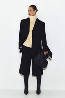 Bright yellow fur scarf from Sayya, showcasing soft, plush texture and stylish warmth for winter fashion.