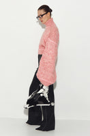 Pink Sayya sweater with a cozy, soft knit texture, featuring a relaxed fit and ribbed cuffs.