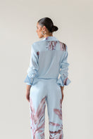 Baby blue Tinta Latina Sabana blouse, a stylish women's top with a comfortable fit and elegant design.