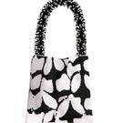 Black and white Clash of Prints shoulder bag by SAC DE SOUL, stylish accessory with bold graphic design.
