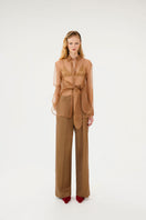 Sepia Mahsa shirt by Mastani featuring lightweight organza fabric and elegant design, displayed on a hanger.