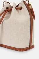 Saonara linen bucket top handle bag with a structured design and natural woven texture, featuring a sturdy top handle.