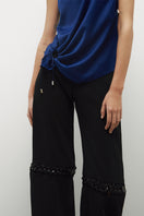 JC Pajares pants with chains, black denim trousers featuring metal chain details and a stylish, edgy design.