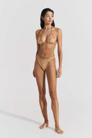 Seaquelle gold bikini top and bottom set, stylish swimwear with a shimmering finish, shown on a model.