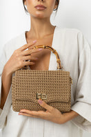 Mara Brazil Serena Bag Lurex top handle bag with metallic finish and structured design, featuring a sleek handle and elegant style.