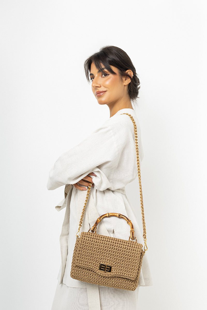 Mara Brazil Serena Bag Lurex top handle bag in metallic fabric with gold-tone hardware, stylish accessory for evening or casual wear.