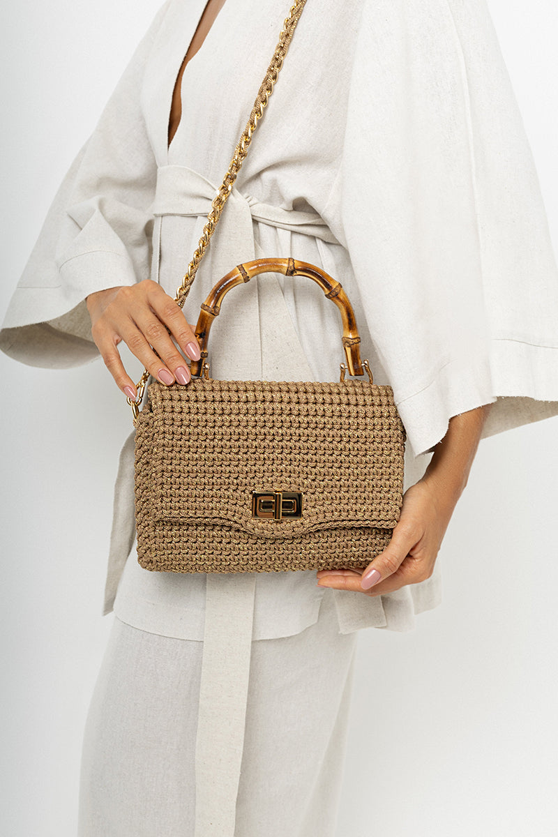 Mara Brazil Serena Bag Lurex top handle bag with metallic gold finish and elegant design, featuring a structured silhouette.