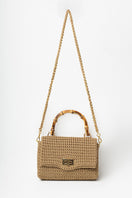 Mara Brazil Serena Bag Lurex top handle bag in shiny metallic fabric with elegant design and gold-tone hardware.