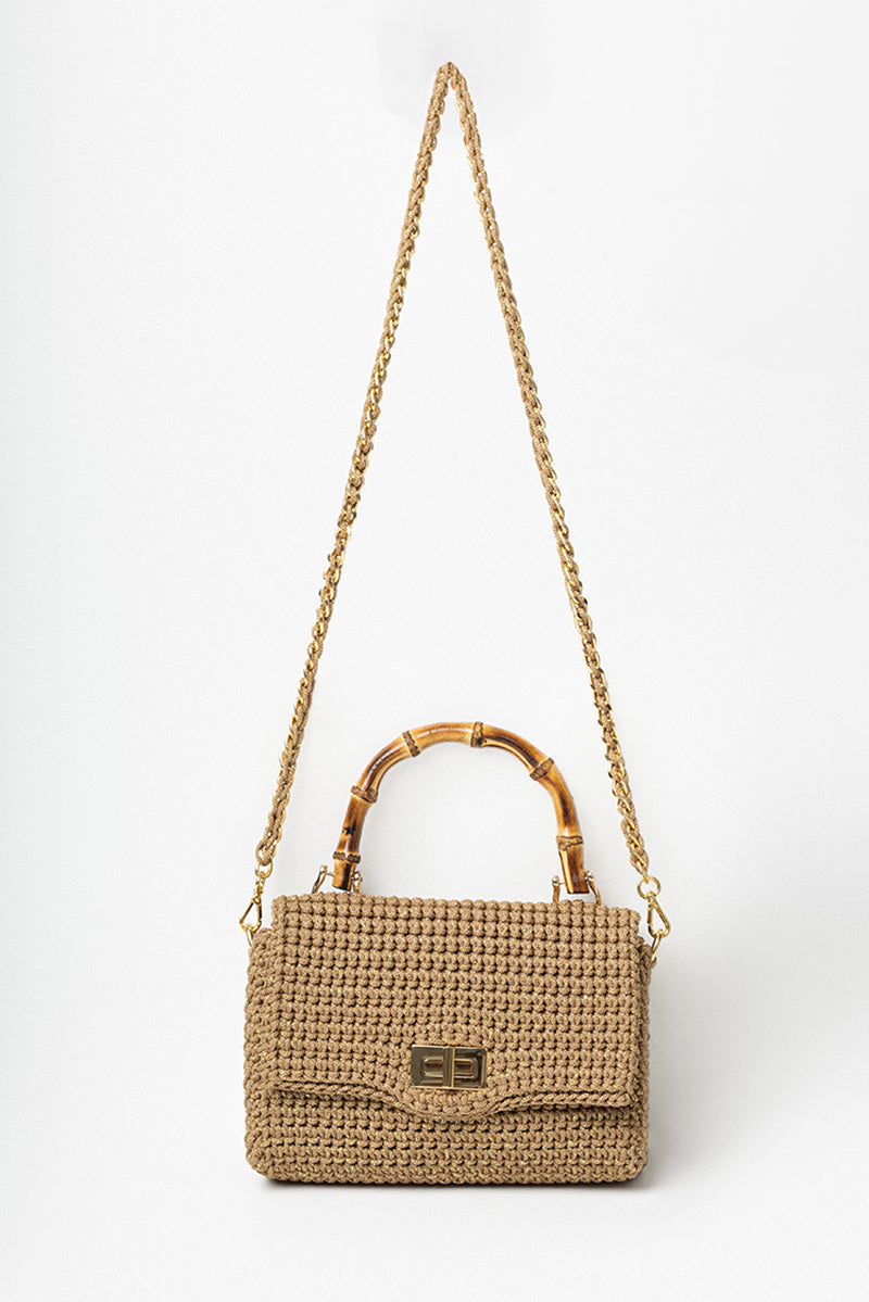 Mara Brazil Serena Bag Lurex top handle bag in shiny metallic fabric with elegant design and gold-tone hardware.