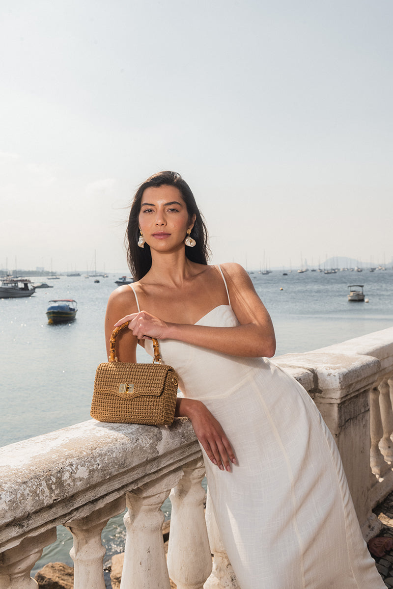 Mara Brazil Serena Bag Lurex top handle bag in gold with metallic finish and structured design, front view.