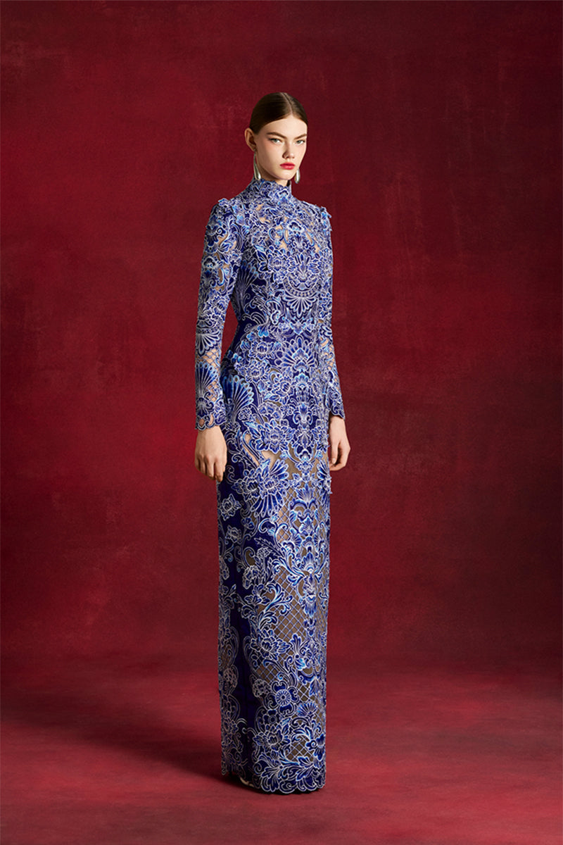 Laser-cut peony gown by Le Thanh Hoa featuring intricate floral lace and elegant flowing fabric for formal occasions.