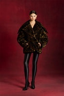 Le Thanh Hoa AONI gold-quilted jacket, stylish outerwear with a shiny quilted design, perfect for cold weather.