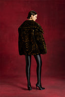 Le Thanh Hoa Aoni gold-quilted jacket with a padded design, featuring a stylish collar and zipper closure.