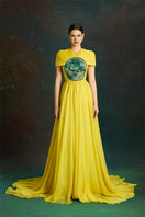Le Thanh Hoa Dragon Sun-Gown featuring intricate dragon embroidery, flowing fabric, and traditional design.