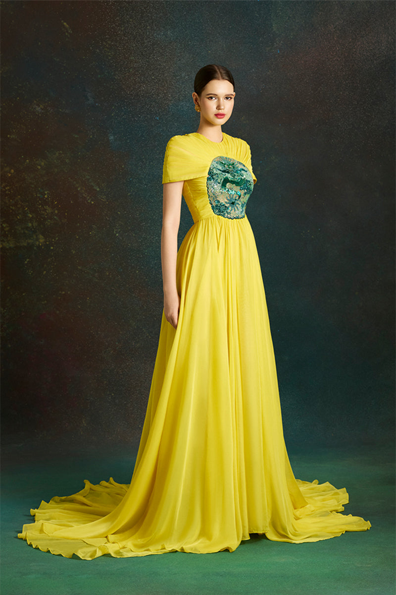 Le Thanh Hoa dragon sun-gown with intricate design, flowing fabric, and vibrant colors, perfect for special occasions.