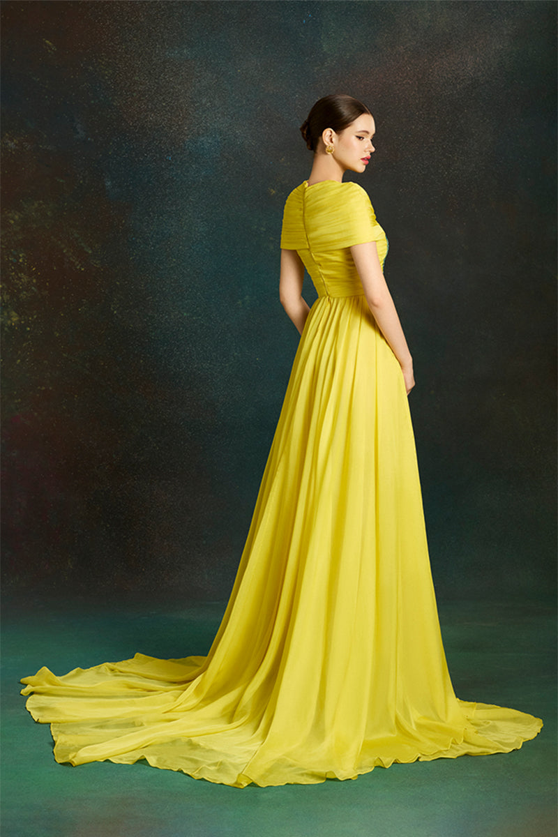 Le Thanh Hoa dragon sun-gown with vibrant embroidered design, flowing fabric, and traditional style for special occasions.